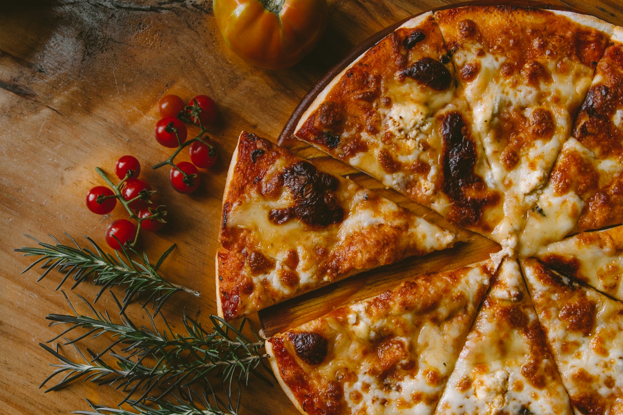 Hand-tossed cheese pizza fresh from Alfonso's oven
